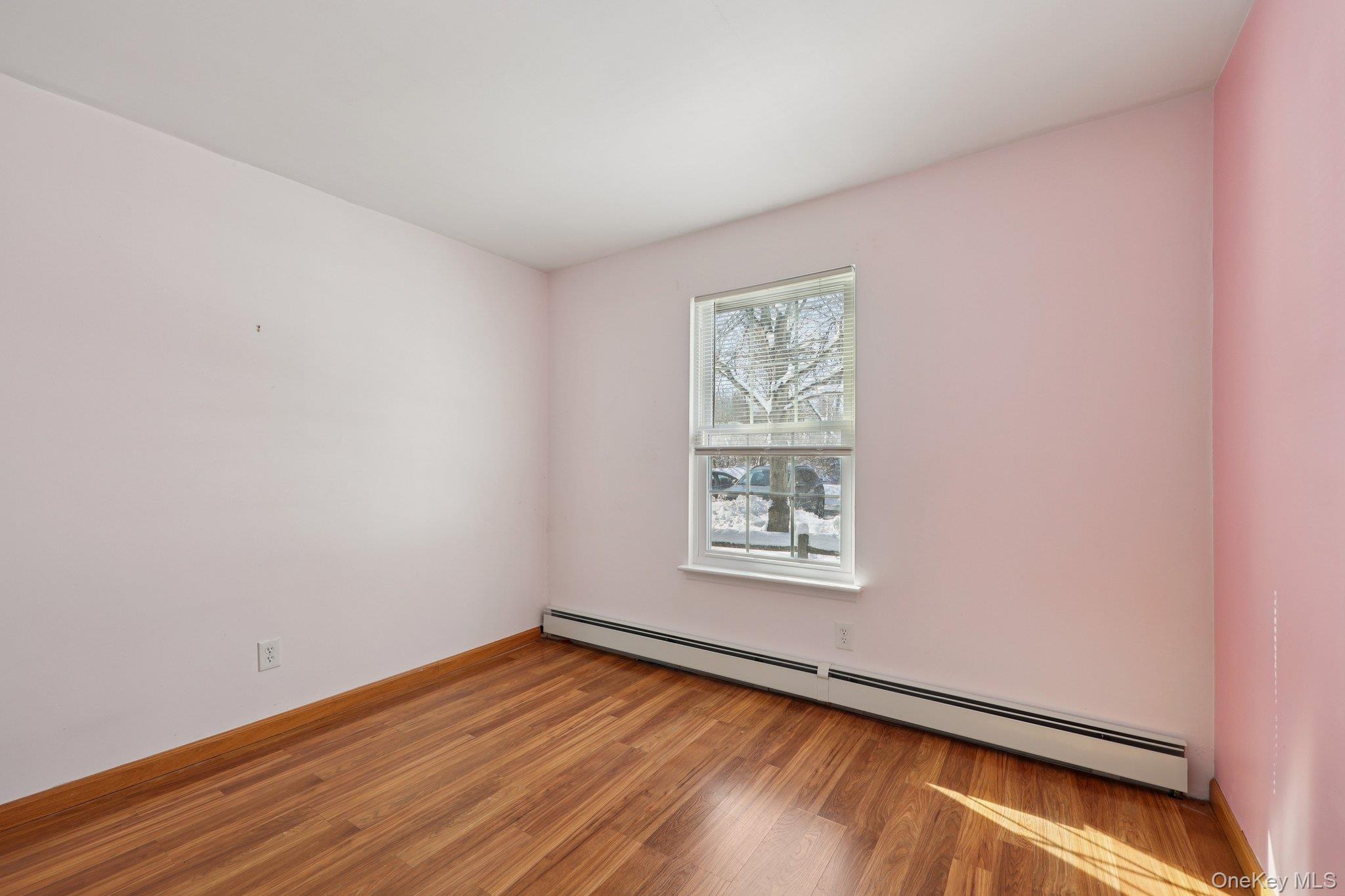 14 Lexington Hills Road, Unit 3 Harriman, NY 10926 - Photo 21 of 30 a view of an empty room with wooden floor and a window
