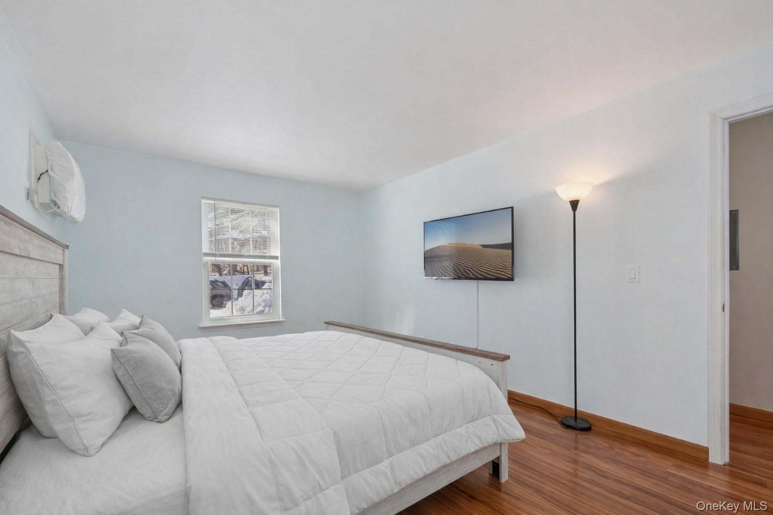 14 Lexington Hills Road, Unit 3 Harriman, NY 10926 - Photo 24 of 30 a bedroom with a bed and a window