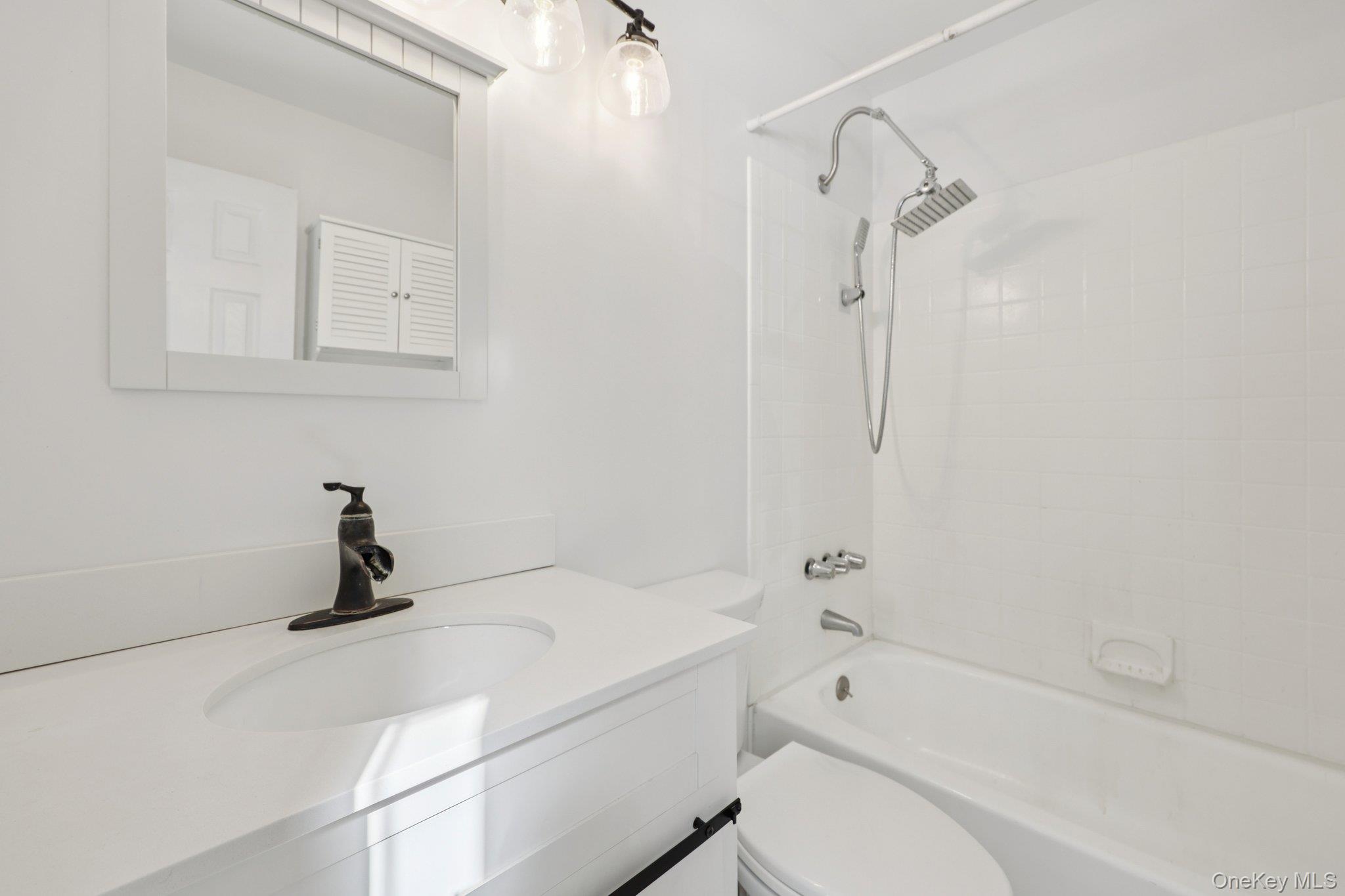 14 Lexington Hills Road, Unit 3 Harriman, NY 10926 - Photo 27 of 30 a bathroom with a sink a toilet and bathtub