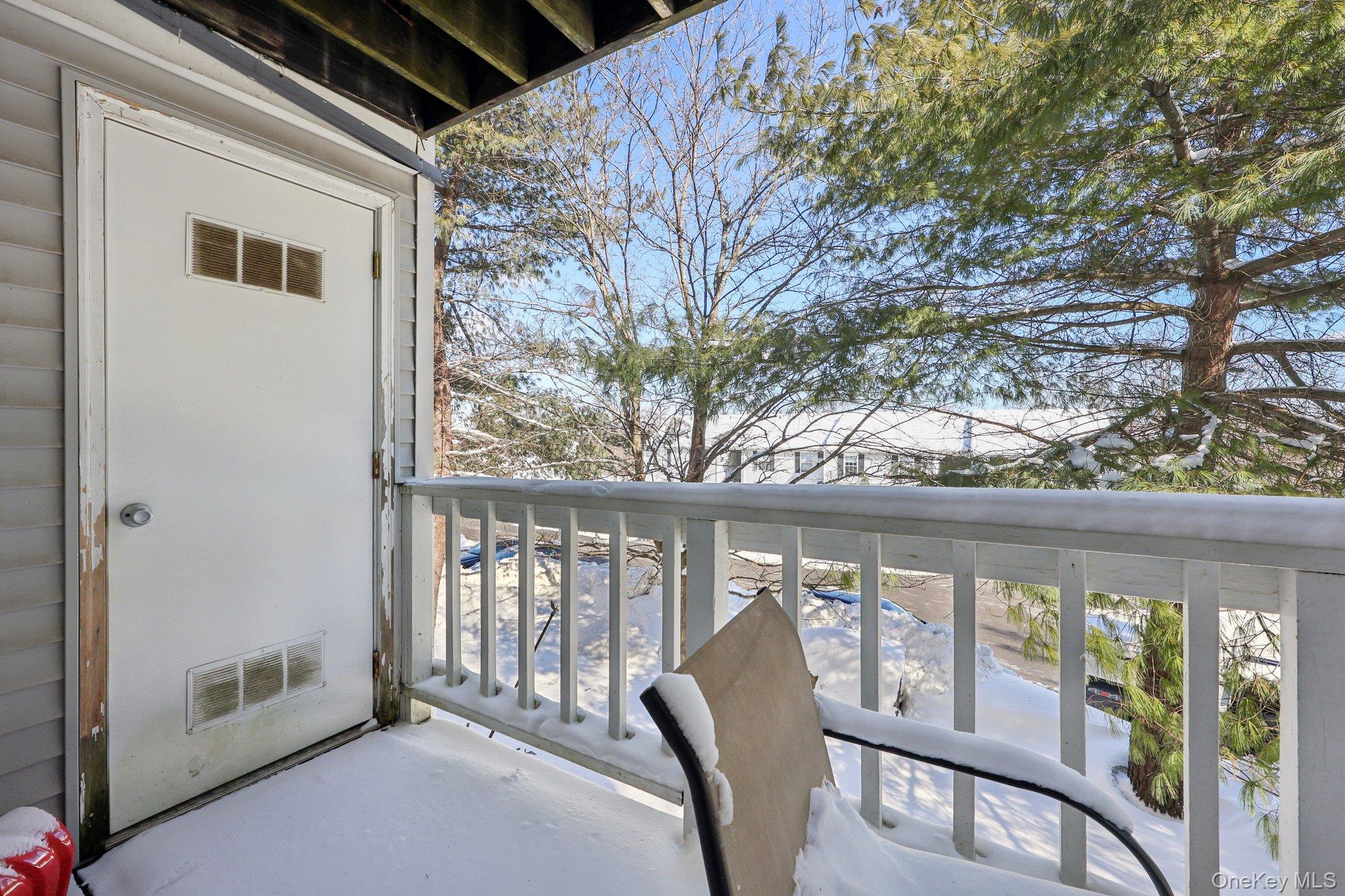 14 Lexington Hills Road, Unit 3 Harriman, NY 10926 - Photo 28 of 30 a view of a porch with furniture and floor to ceiling window