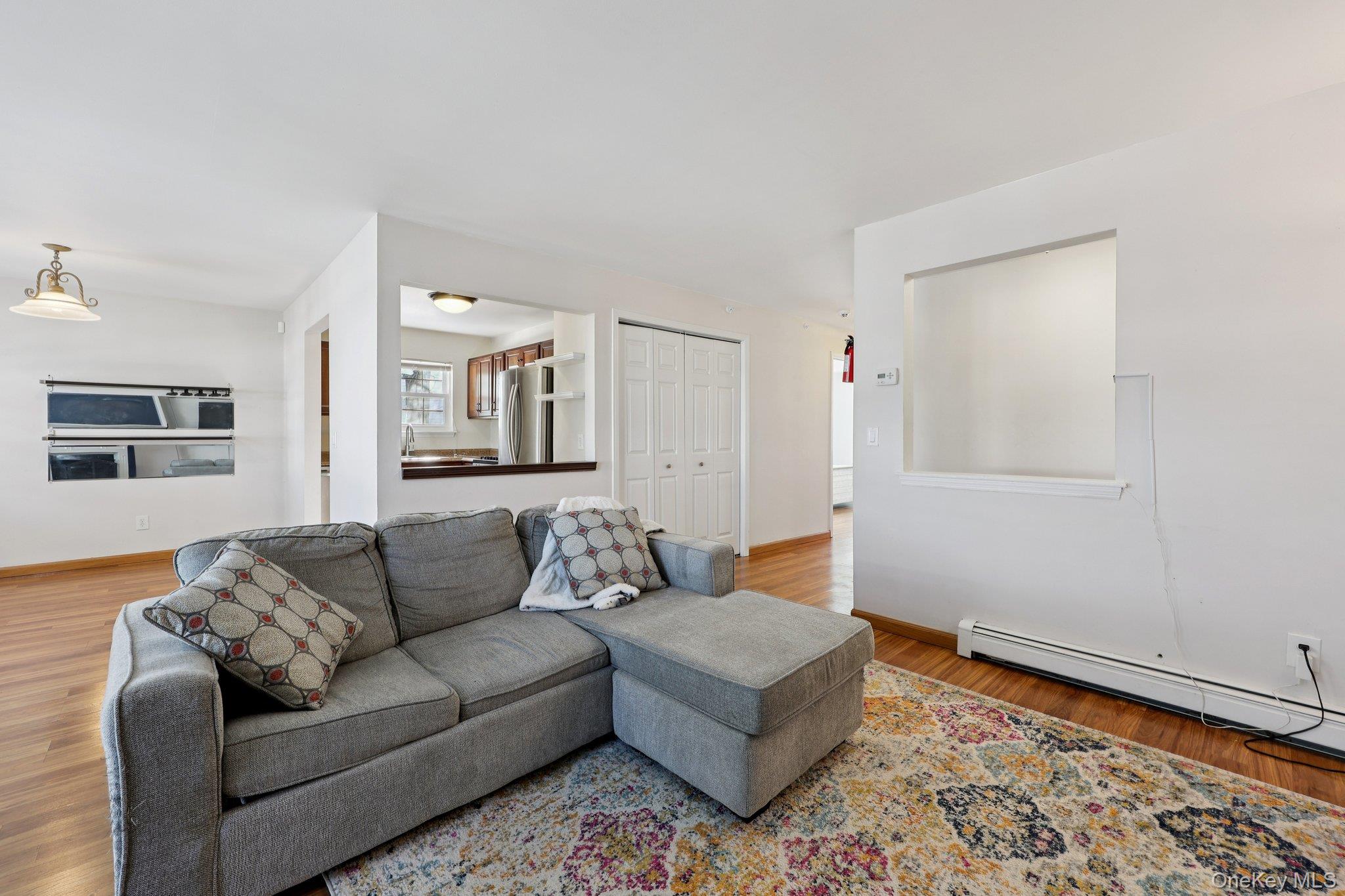 14 Lexington Hills Road, Unit 3 Harriman, NY 10926 - Photo 6 of 30 a living room with furniture and wooden floor
