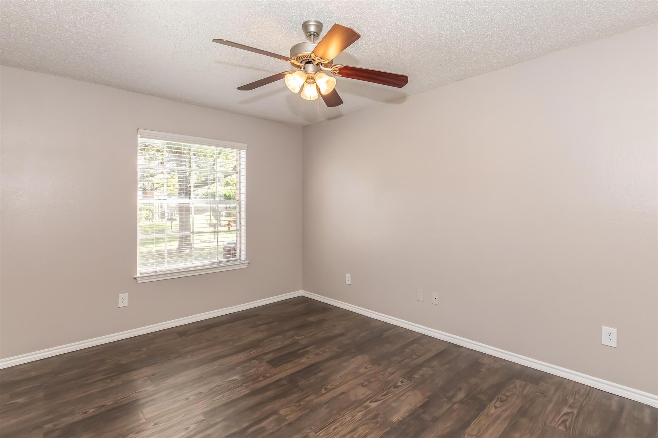 8301 Boat Club Road, Unit 412 Fort Worth, TX 76179 - Photo 5 of 45 an empty room with wooden floor and windows