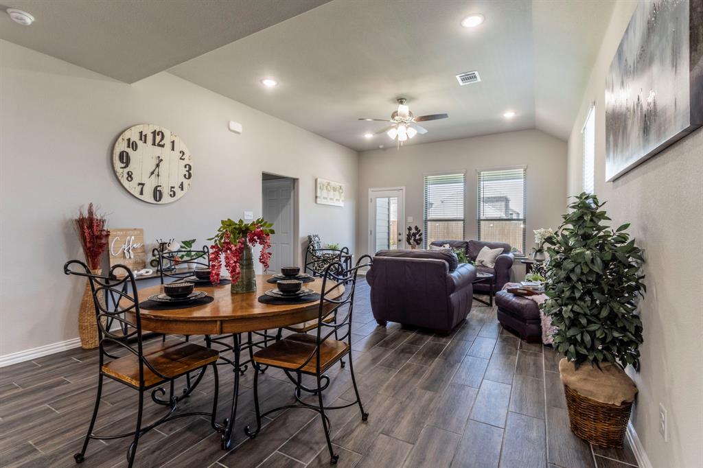 626 Ruthye Lane Pilot Point, TX 76258 - Photo 14 of 27 Dining space with wood-look tile floors, recessed lighting, ceiling fan, and lofted ceiling
