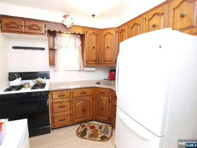 a kitchen with a cabinets and appliances
