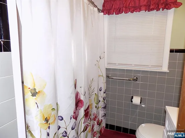 a bathroom with a shower curtain