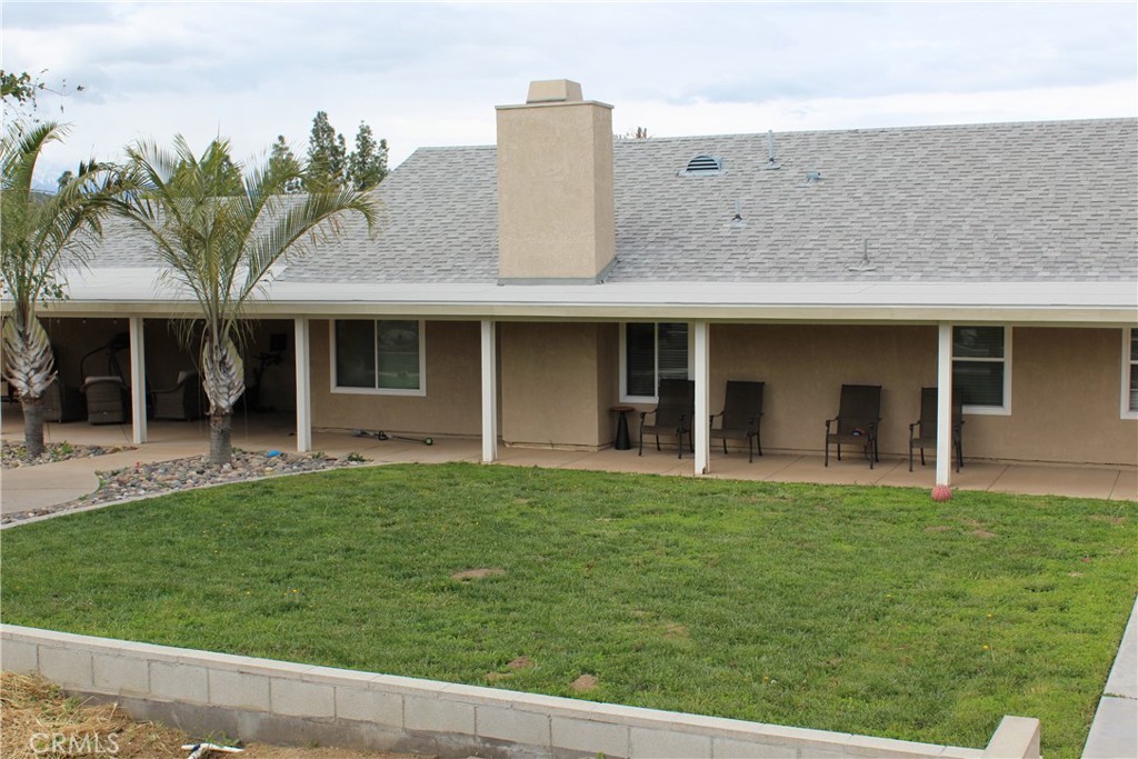 450 Trabert Circle Riverside, CA 92507 - Photo 1 of 1 a front view of a house with a garden