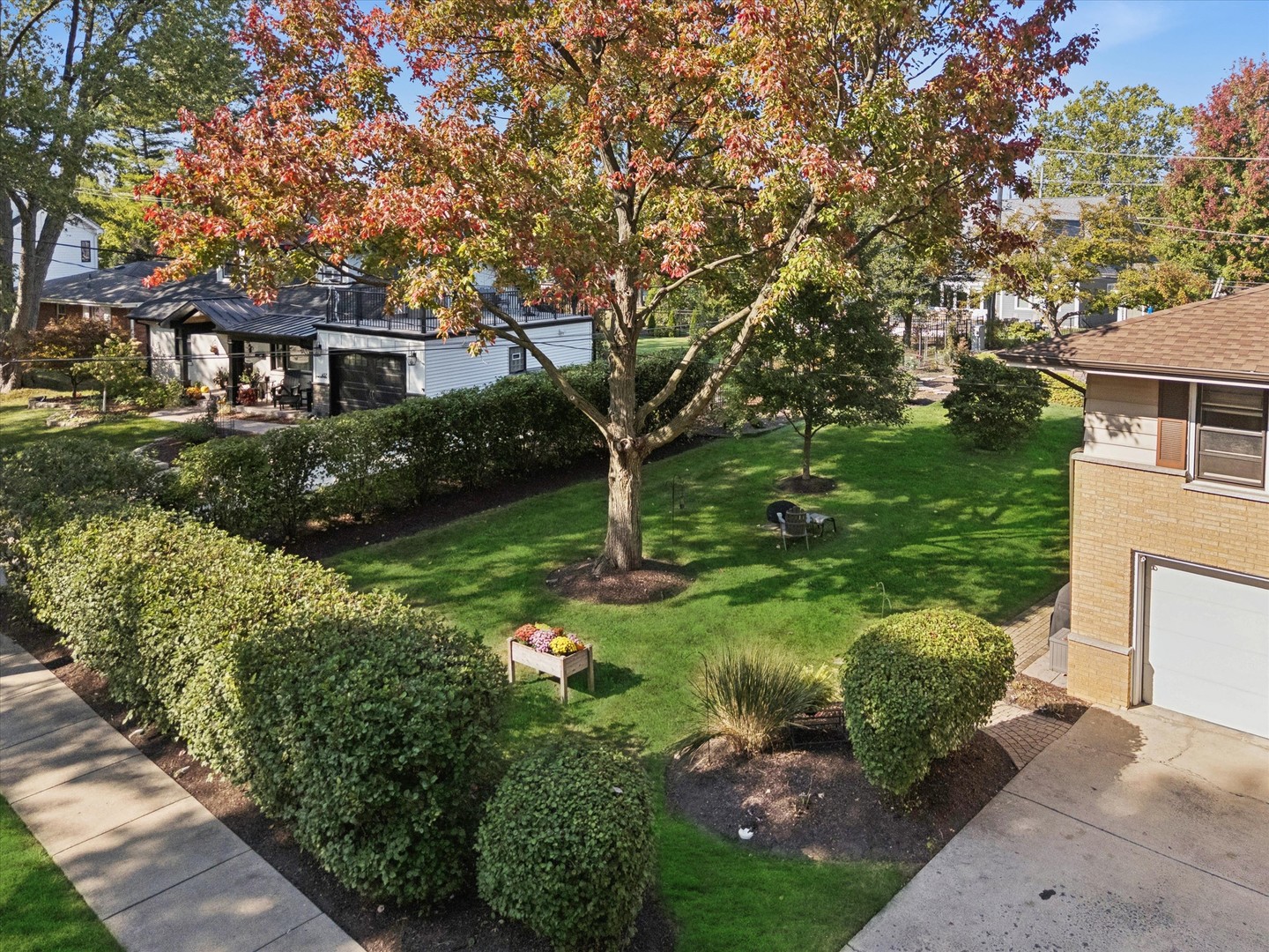465 East Hillside Road Naperville, IL 60540 - Photo 19 of 23 a view of a house with a garden