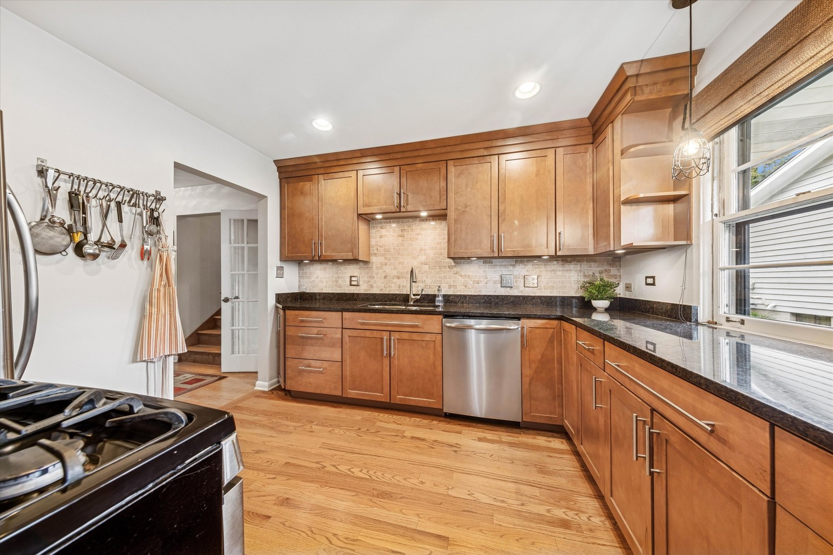 465 East Hillside Road Naperville, IL 60540 - Photo 4 of 23 a kitchen with a sink stove and refrigerator