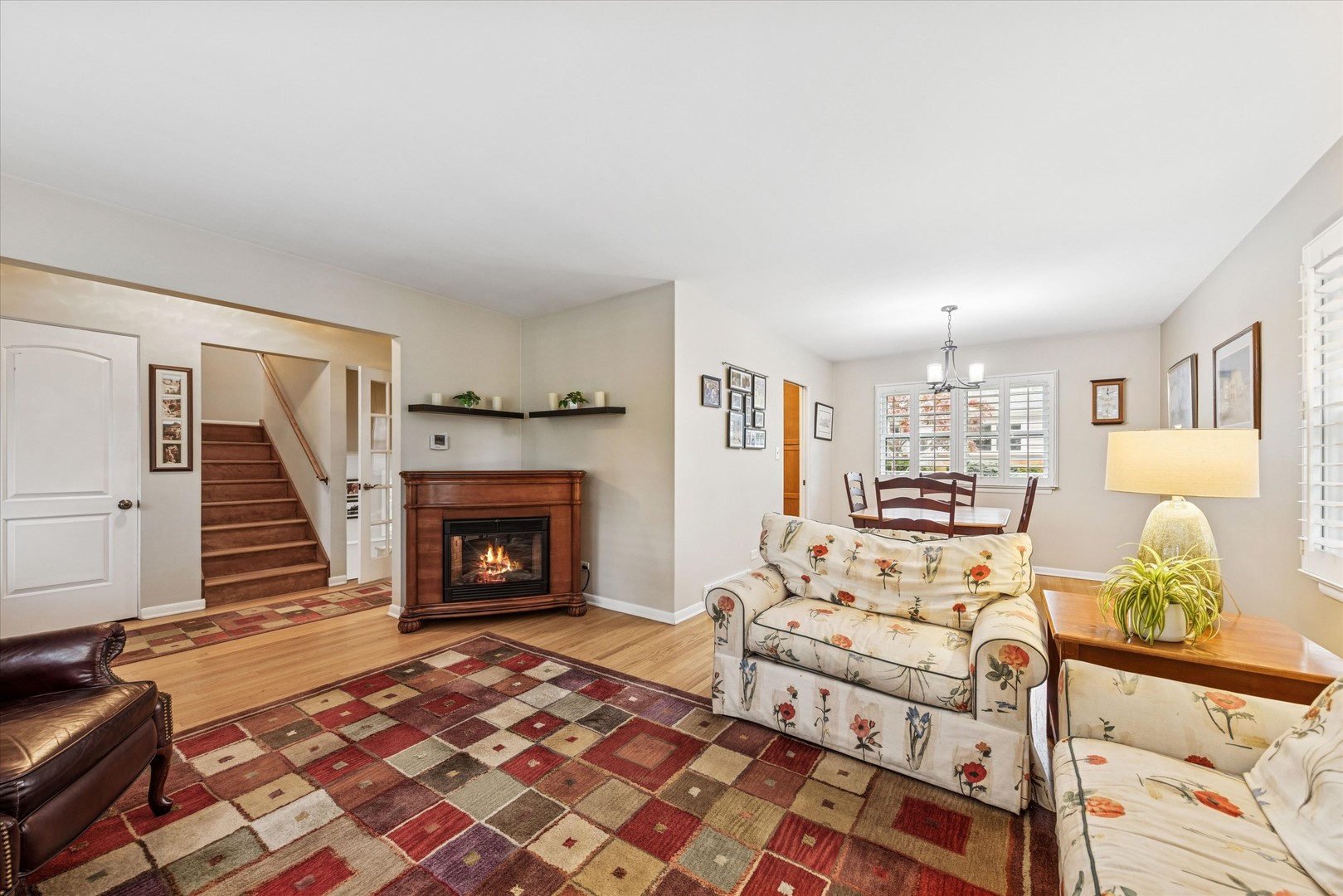 465 East Hillside Road Naperville, IL 60540 - Photo 5 of 23 a living room with furniture and a fireplace
