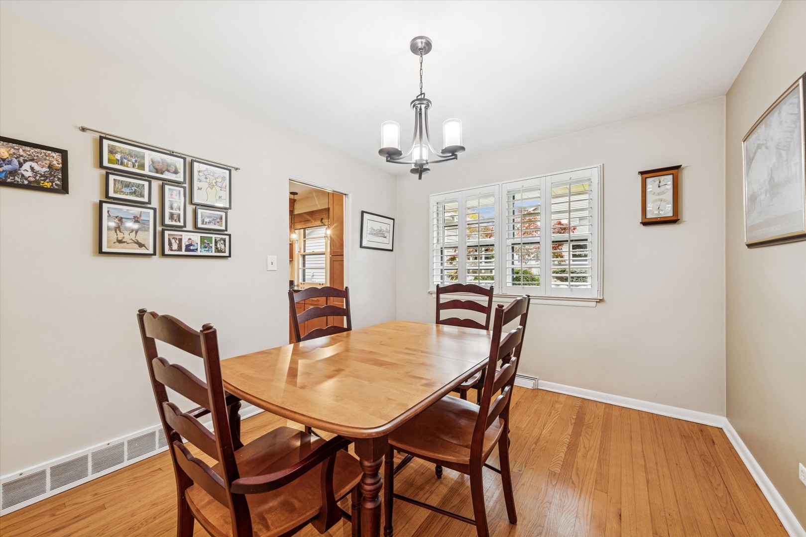 465 East Hillside Road Naperville, IL 60540 - Photo 7 of 23 a view of a dining room with furniture window and wooden floor