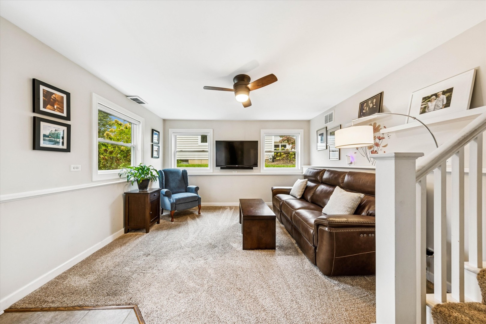 465 East Hillside Road Naperville, IL 60540 - Photo 8 of 23 a living room with furniture and a flat screen tv