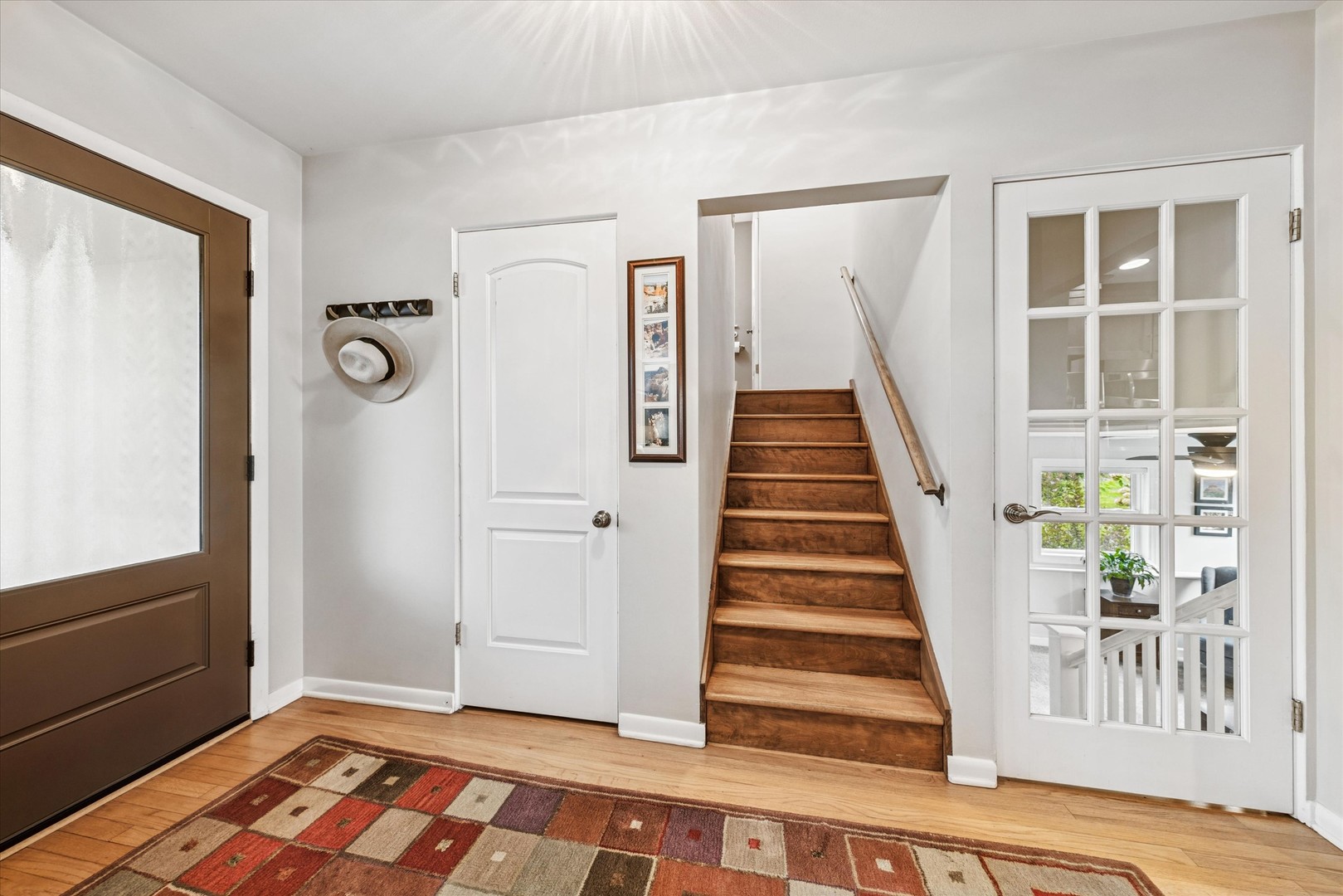 465 East Hillside Road Naperville, IL 60540 - Photo 10 of 23 a view of entryway with wooden floor and stairs