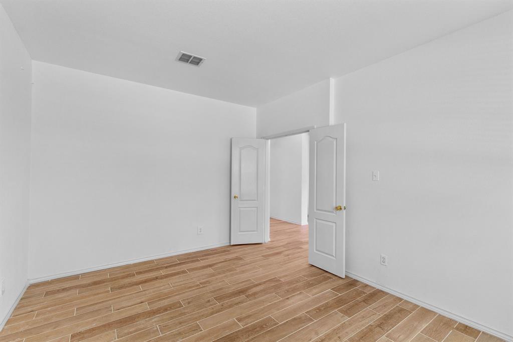 2700 Hereford Road Denton, TX 76210 - Photo 11 of 36 Interior room featuring wood-finish flooring, white walls, and white trim