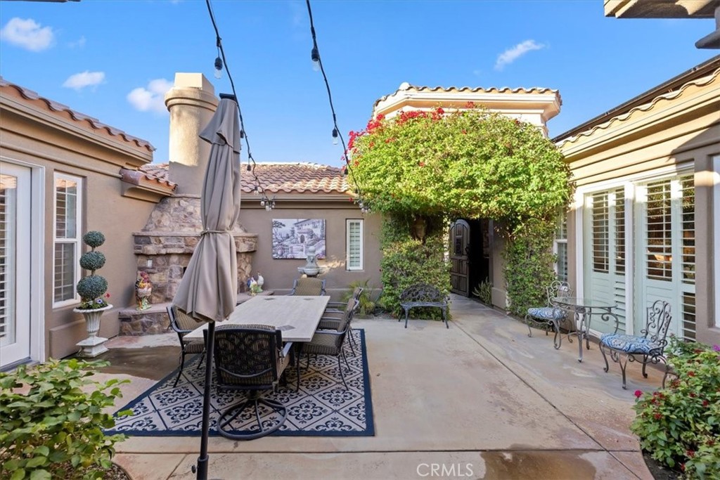 20 Vista Encantada Rancho Mirage, CA 92270 - Photo 11 of 75 a view of a patio with table and chairs and potted plants