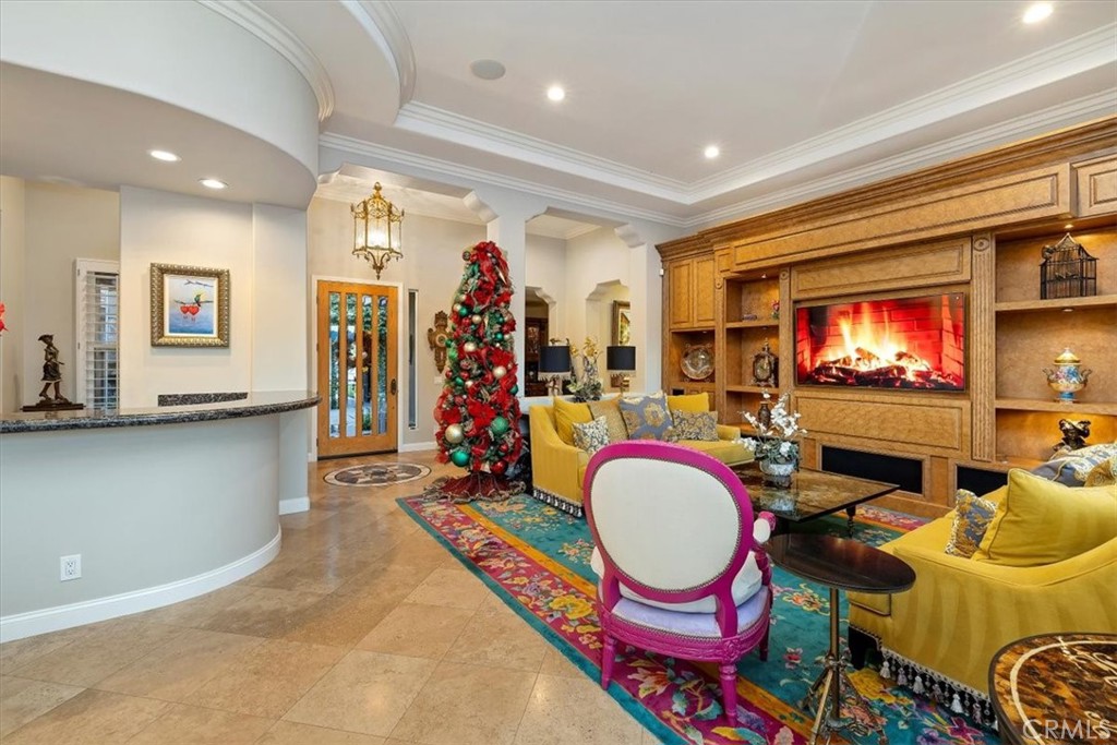 20 Vista Encantada Rancho Mirage, CA 92270 - Photo 14 of 75 a living room with furniture a flat screen tv and a fireplace