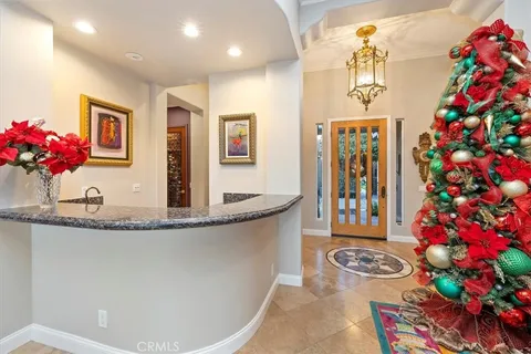 a kitchen with granite countertop sink stove and cabinets