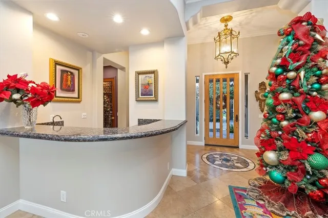 a kitchen with granite countertop sink stove and cabinets