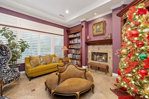 a living room with furniture and a dining room