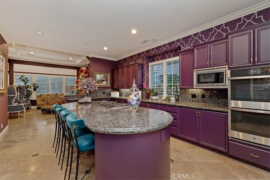 20 Vista Encantada Rancho Mirage, CA 92270 - Photo 27 of 75 a kitchen with stainless steel appliances granite countertop a stove a sink dishwasher a microwave oven with granite countertops and cabinets
