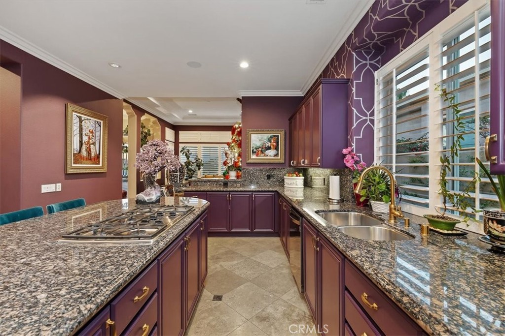 20 Vista Encantada Rancho Mirage, CA 92270 - Photo 28 of 75 a kitchen with granite countertop sink stove and cabinets