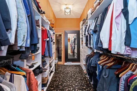 an aerial view of residential houses with outdoor space and river