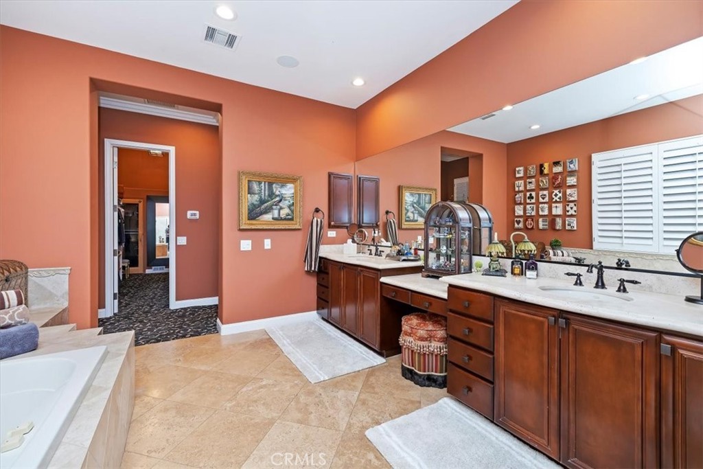 20 Vista Encantada Rancho Mirage, CA 92270 - Photo 48 of 75 a kitchen with a sink stove and cabinets