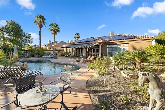 a view of a swimming pool with a patio