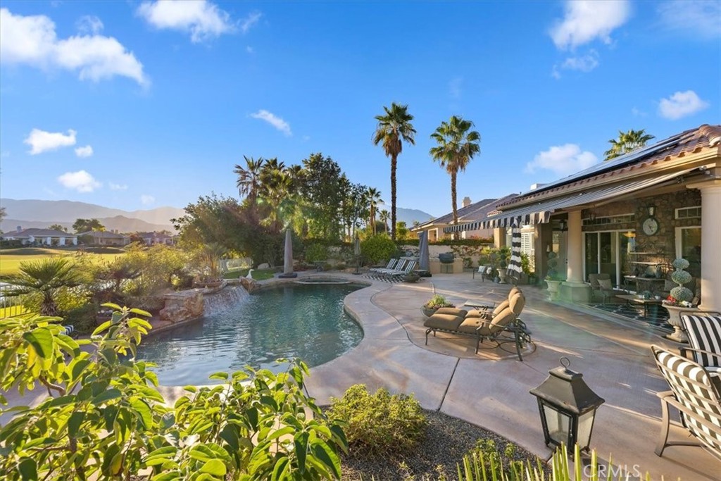 20 Vista Encantada Rancho Mirage, CA 92270 - Photo 55 of 75 a swimming pool with outdoor seating and a yard