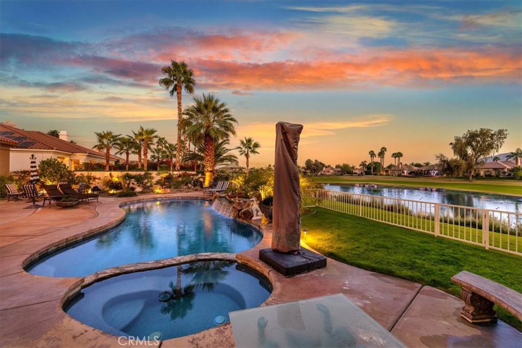 20 Vista Encantada Rancho Mirage, CA 92270 - Photo 73 of 75 a view of a swimming pool with a lounge chairs