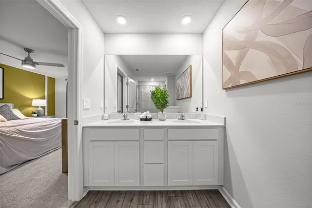 a bathroom with a sink a mirror and a toilet