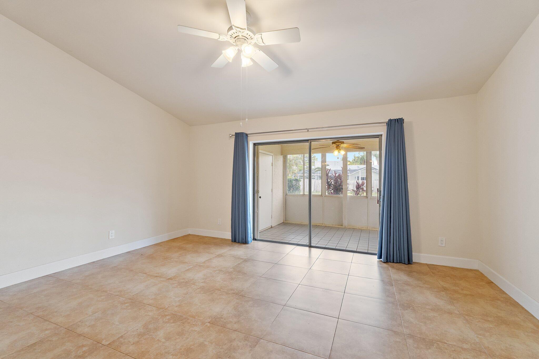 109 Doe Trail Jupiter, FL 33458 - Photo 9 of 26 an empty room with fan and windows