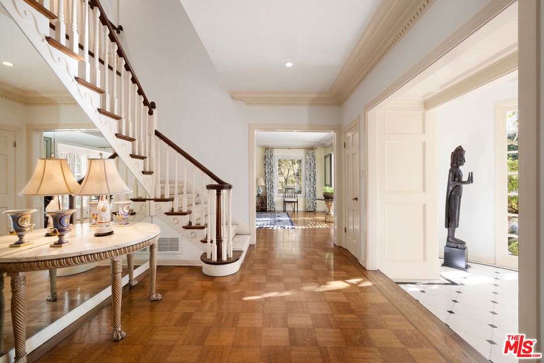 524 North Rockingham Avenue Los Angeles, CA 90049 - Photo 5 of 24 a view of an entryway with wooden floor