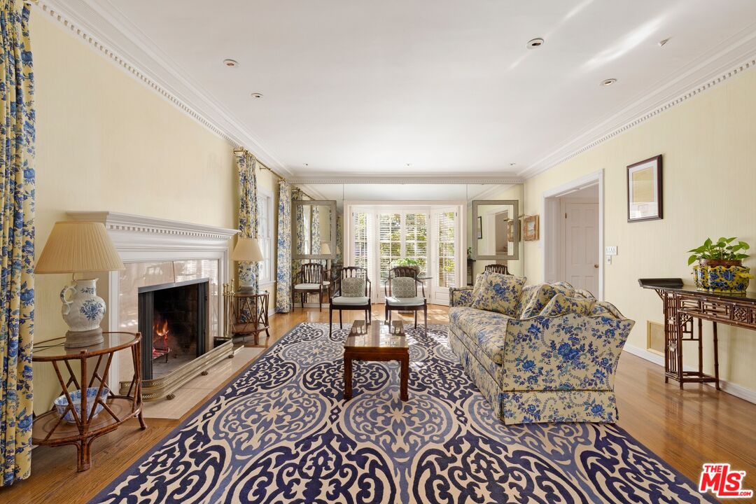 524 North Rockingham Avenue Los Angeles, CA 90049 - Photo 6 of 24 a living room with furniture and a fireplace