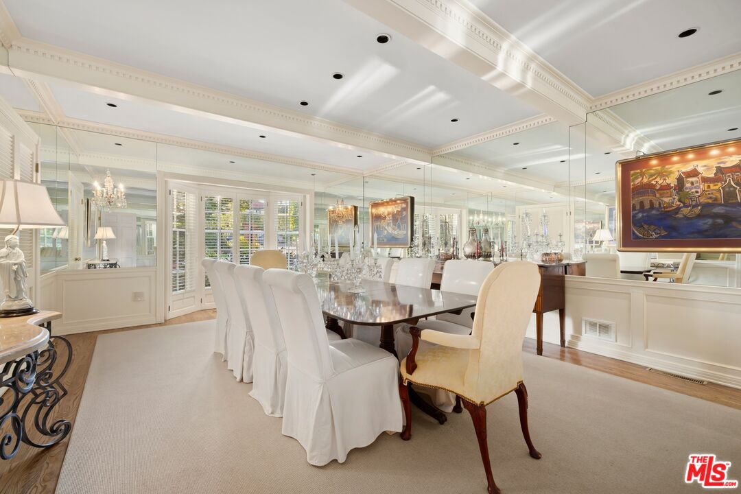 524 North Rockingham Avenue Los Angeles, CA 90049 - Photo 9 of 24 a view of a dining room with furniture and chandelier