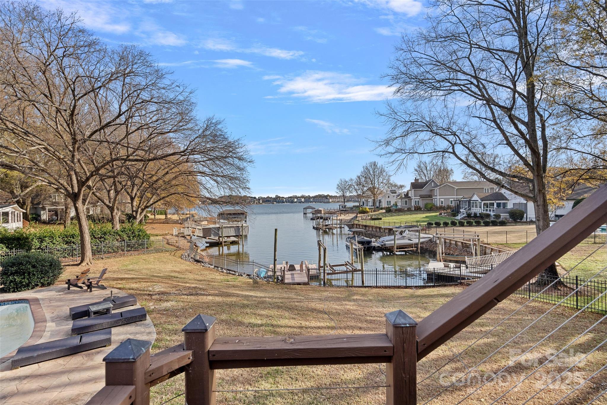 18032 Nantz Road Cornelius, NC 28031 - Photo 13 of 26 a view of a balcony with two chairs and a table
