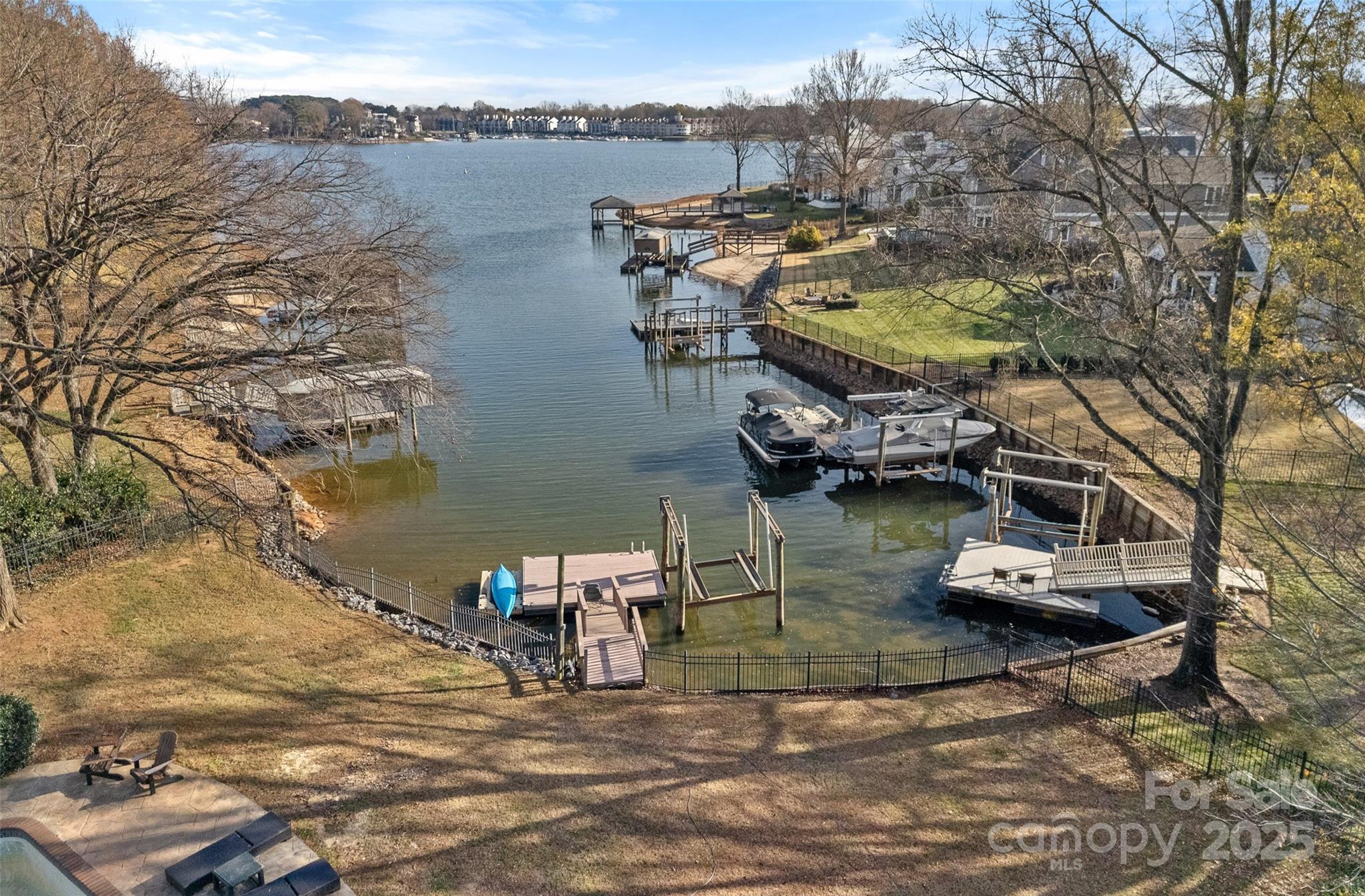 18032 Nantz Road Cornelius, NC 28031 - Photo 4 of 26 a view of a lake in between two chairs