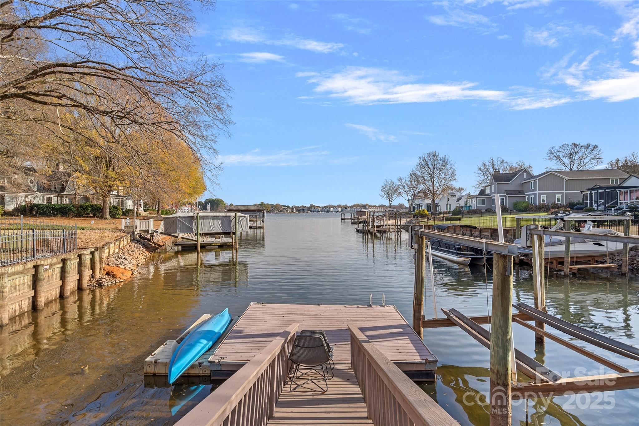 18032 Nantz Road Cornelius, NC 28031 - Photo 10 of 26 a view of a lake with a table and chairs