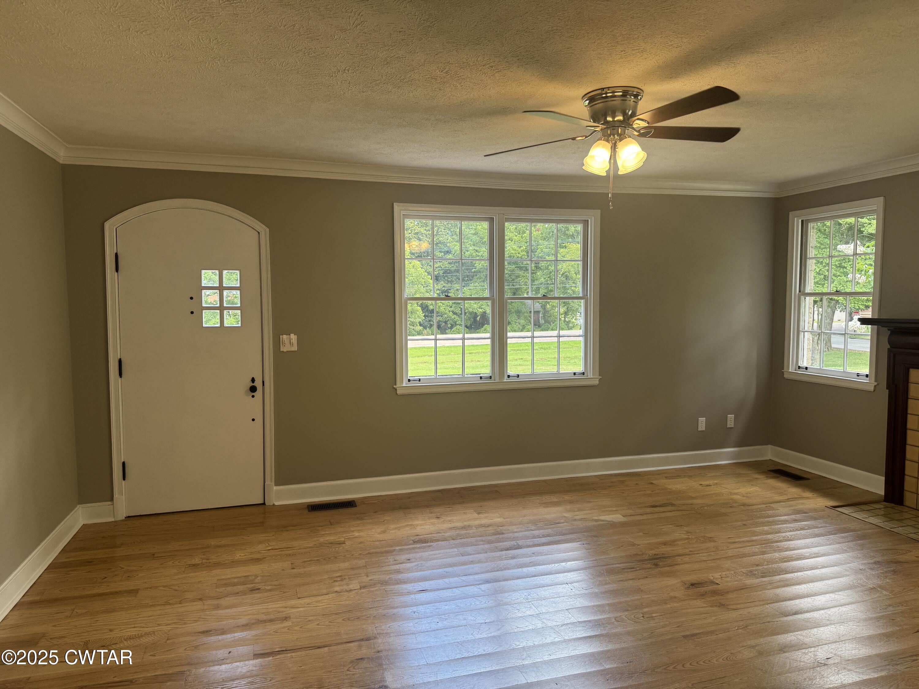 511 White Avenue Henderson, TN 38340 - Photo 13 of 28 a view of an empty room with wooden floor and a window
