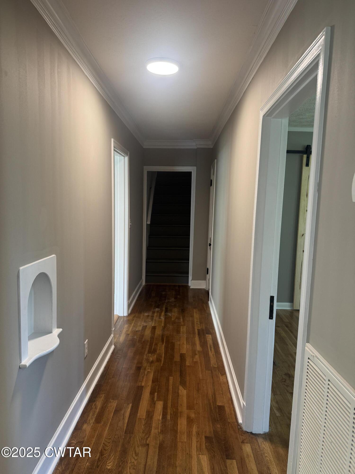 511 White Avenue Henderson, TN 38340 - Photo 19 of 28 a view of a hallway with wooden floor and entryway