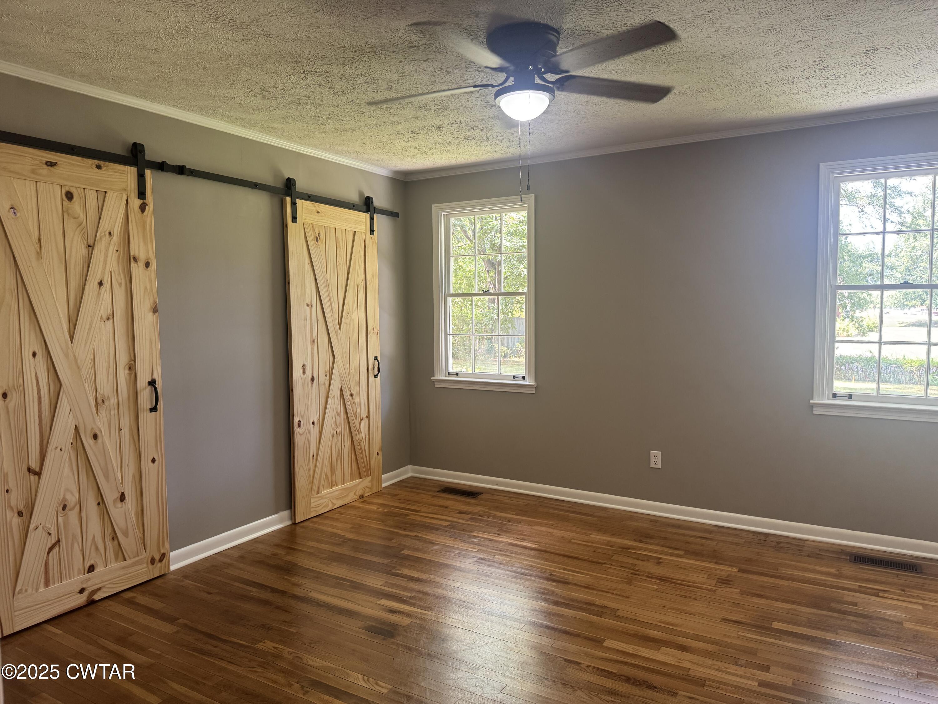511 White Avenue Henderson, TN 38340 - Photo 20 of 28 a view of an empty room with wooden floor and a window