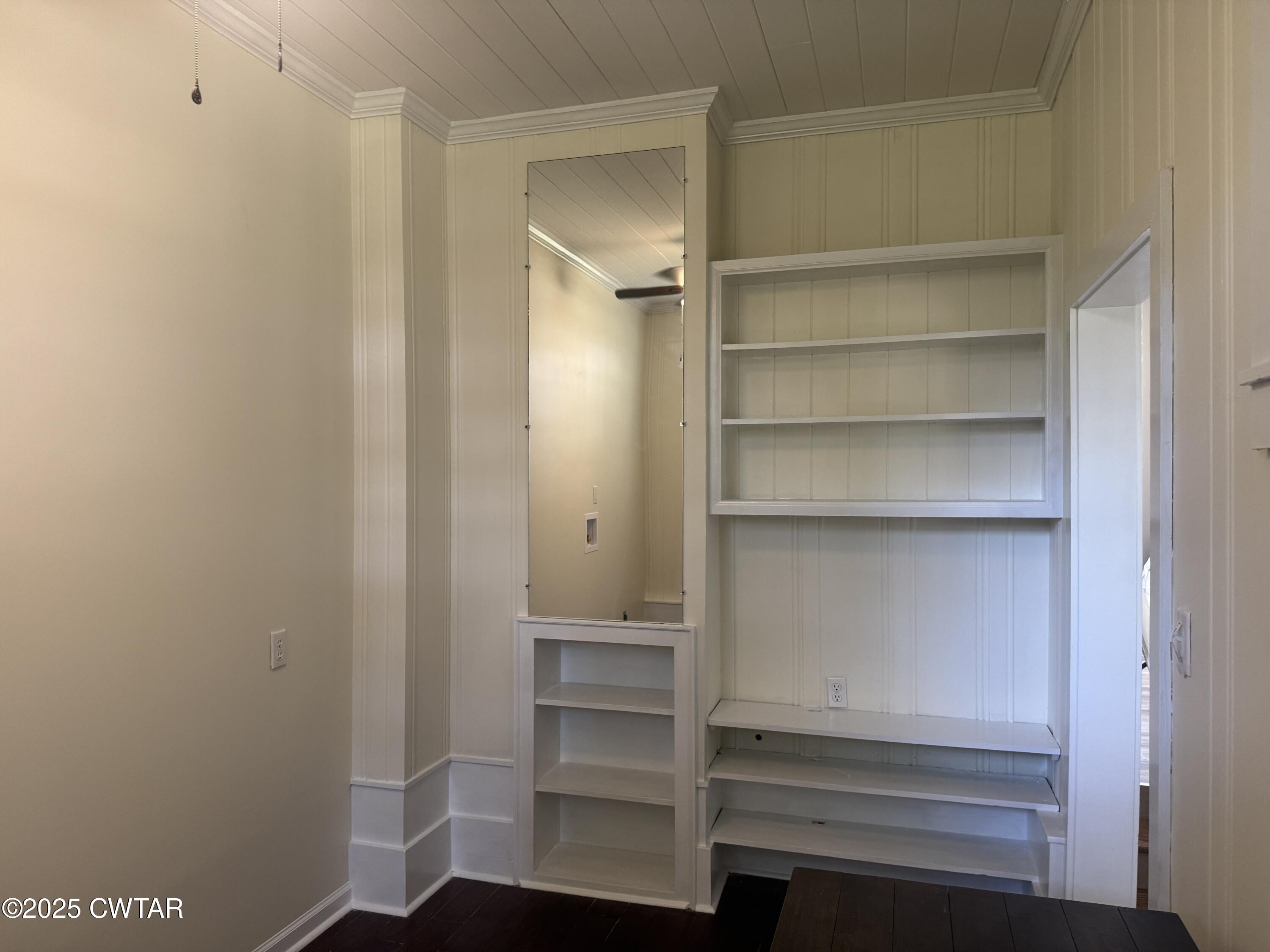 511 White Avenue Henderson, TN 38340 - Photo 24 of 28 a view of walk in closet with empty racks