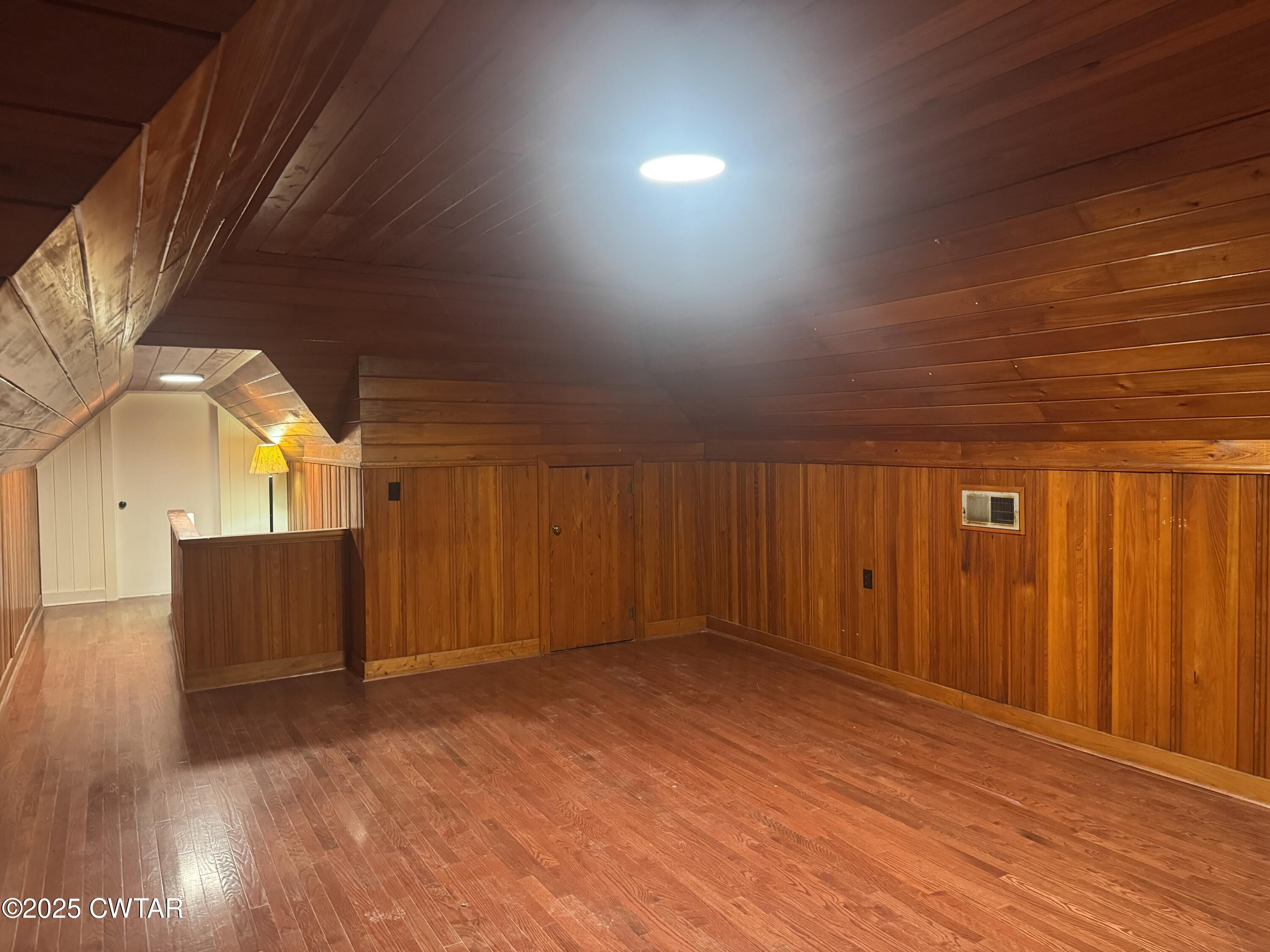 511 White Avenue Henderson, TN 38340 - Photo 25 of 28 en empty room with wooden floor and windows