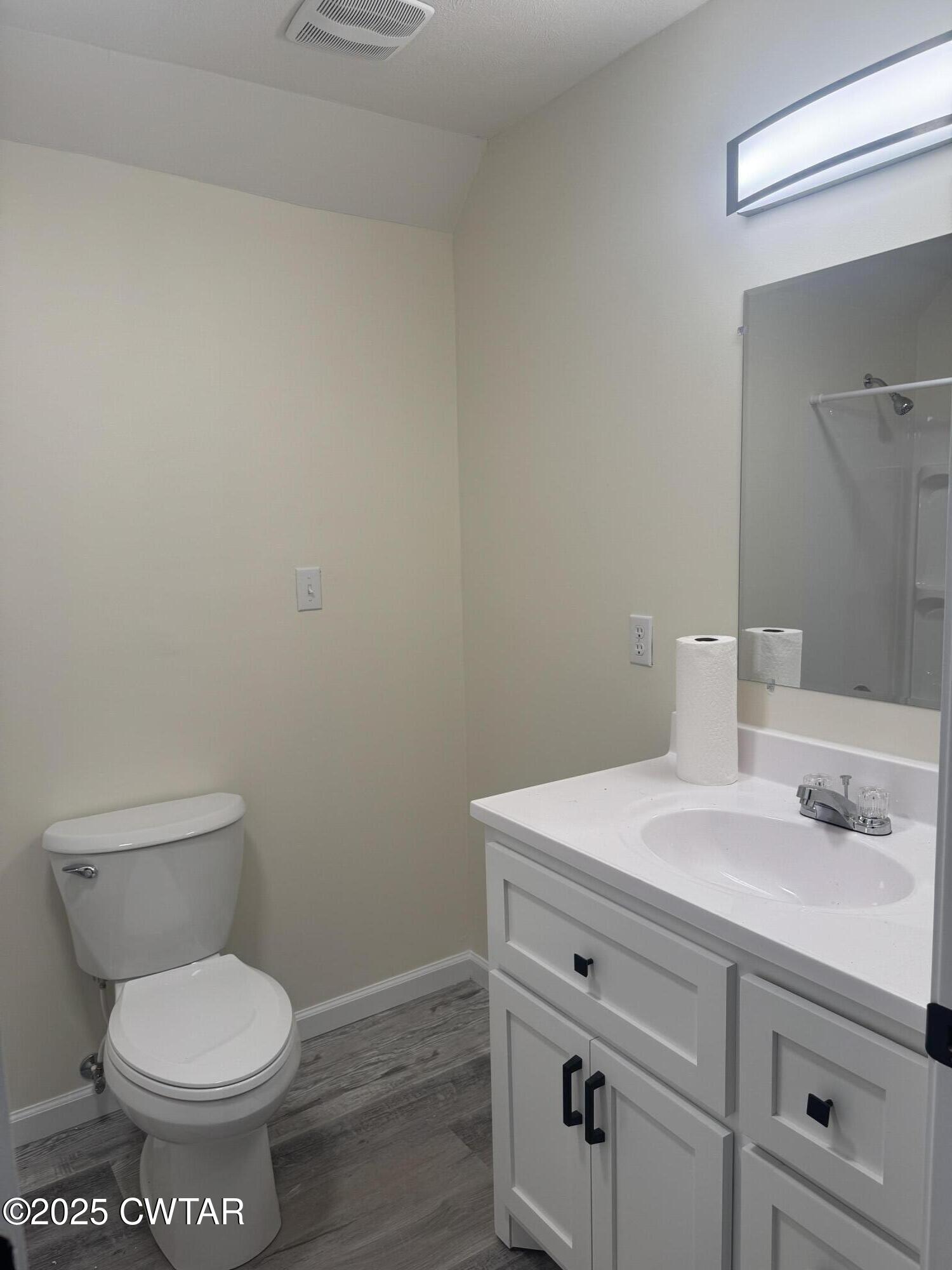 511 White Avenue Henderson, TN 38340 - Photo 26 of 28 a bathroom with a toilet and a sink