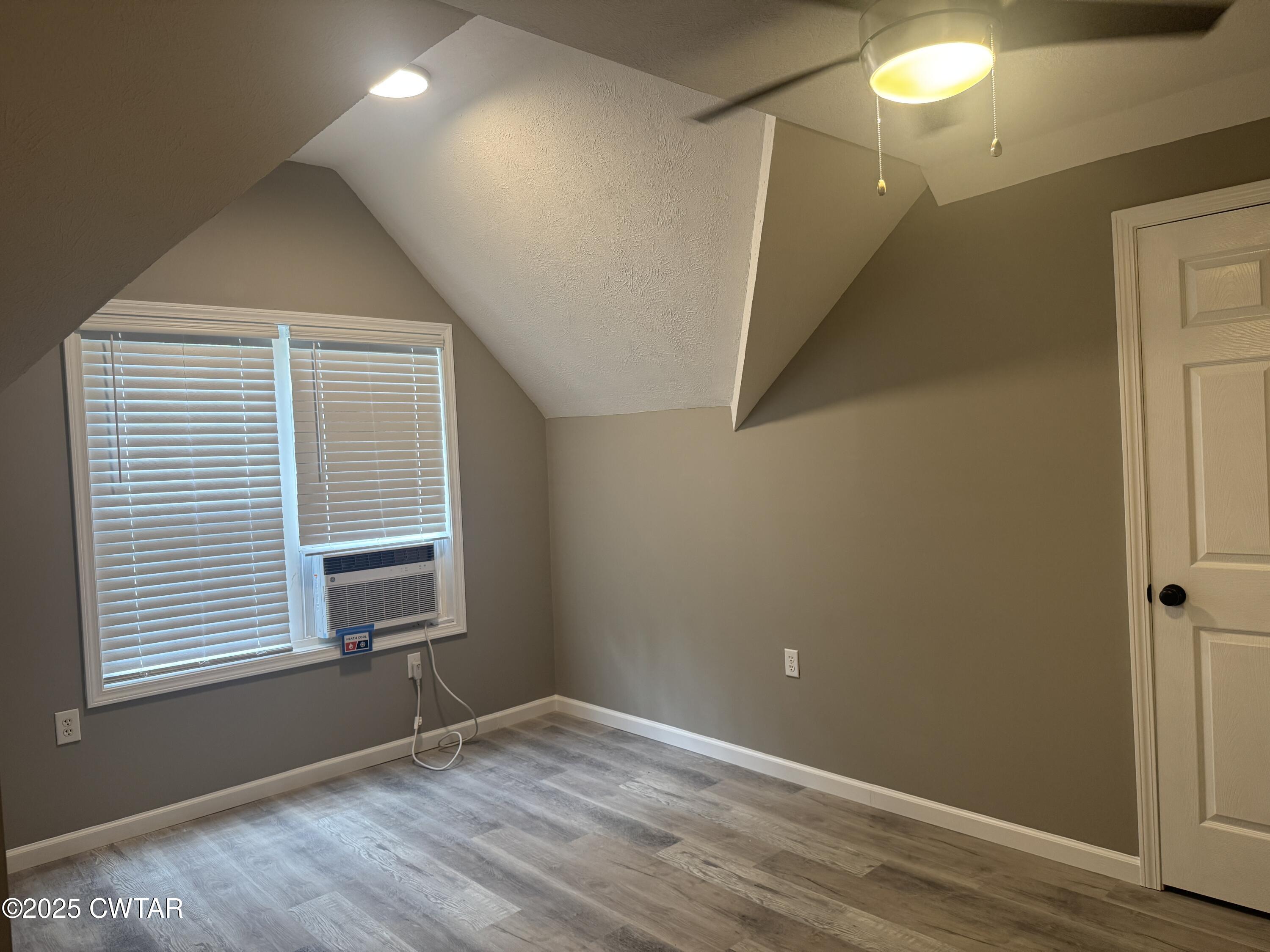 511 White Avenue Henderson, TN 38340 - Photo 28 of 28 a view of an empty room with wooden floor and a window