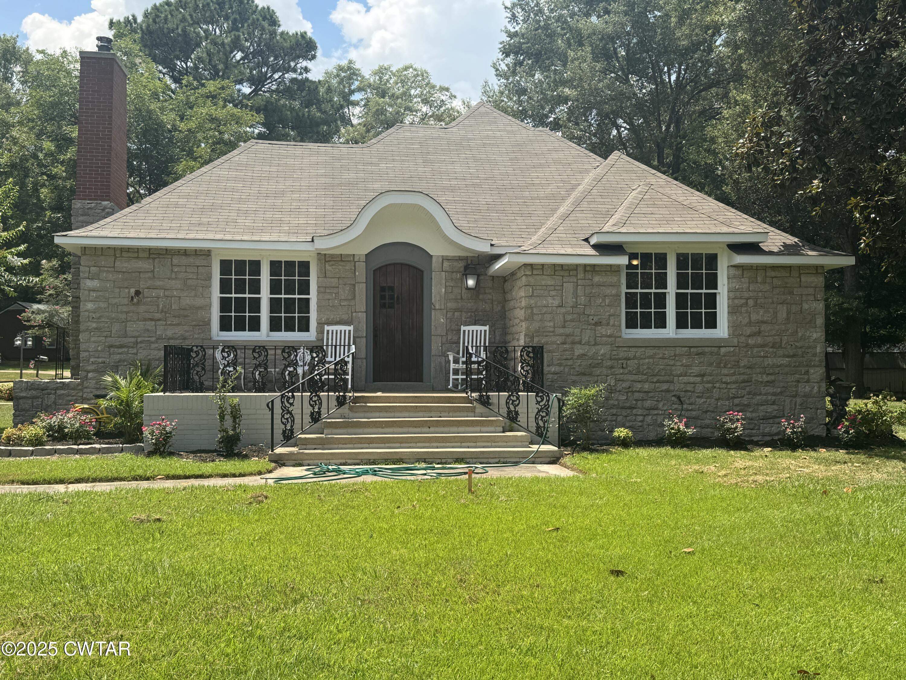 511 White Avenue Henderson, TN 38340 - Photo 3 of 28 a front view of a house with a yard