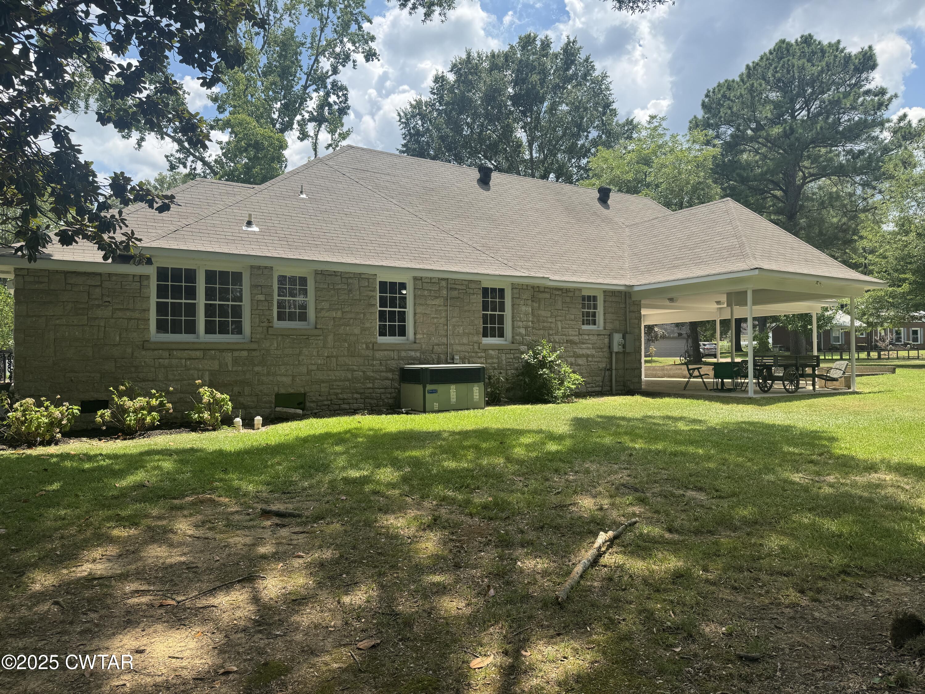 511 White Avenue Henderson, TN 38340 - Photo 4 of 28 a front view of a house with a garden