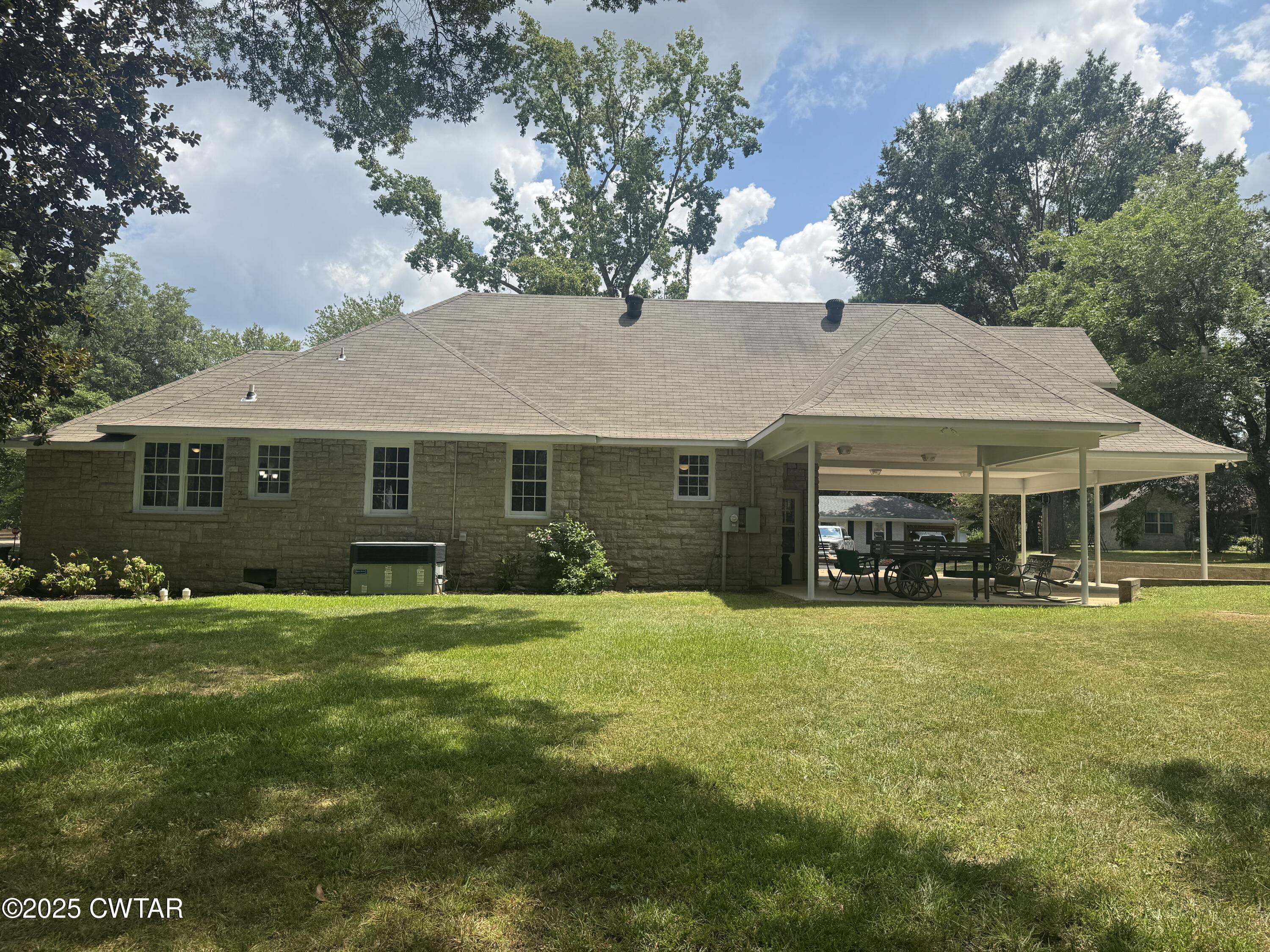 511 White Avenue Henderson, TN 38340 - Photo 5 of 28 a view of a house with a yard and sitting area