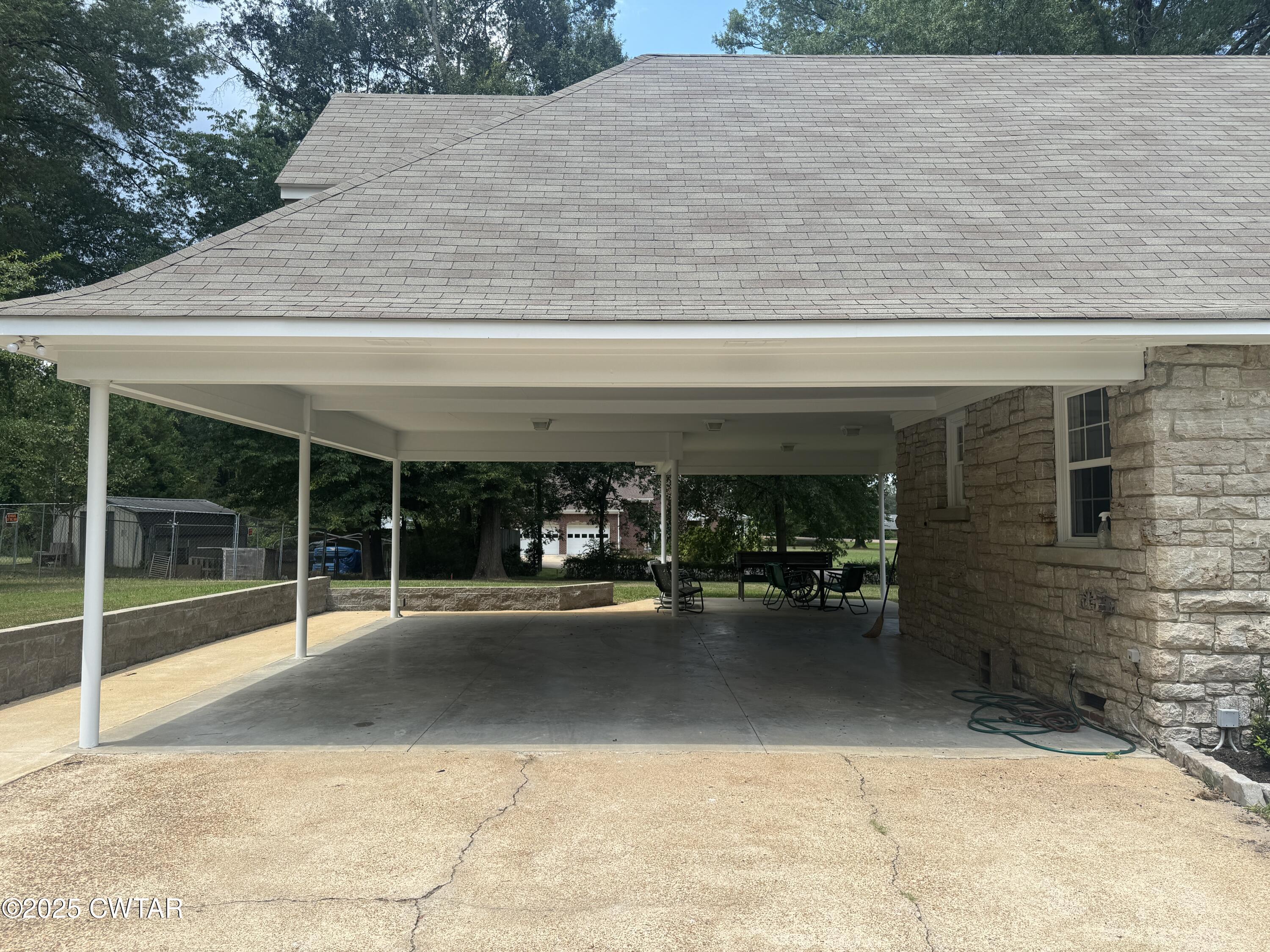 511 White Avenue Henderson, TN 38340 - Photo 10 of 28 a view of a patio with table and chairs and potted plants