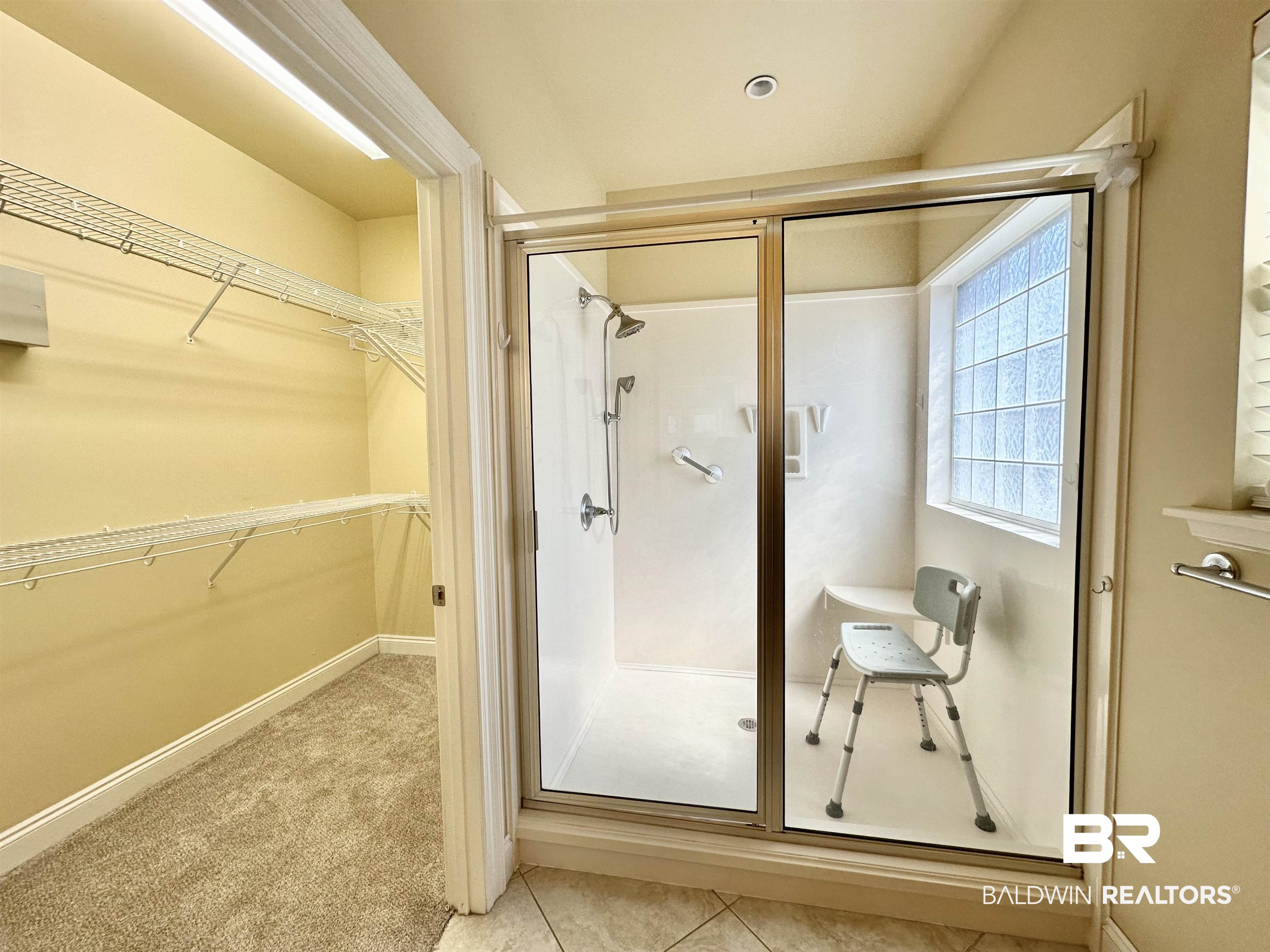 249 Hemingway Loop Foley, AL 36535 - Photo 13 of 33 Bathroom with a shower with door and tile patterned flooring
