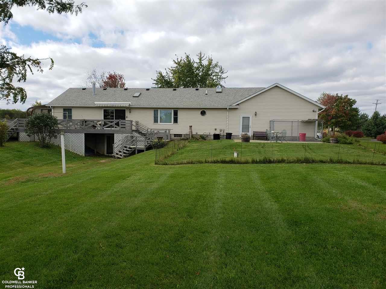 5610 Capac Road Capac, MI 48014 - Photo 2 of 28 This is a view of the back of the home.